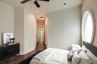 The third bedroom located on the second floor offers a serene retreat for guests or family members, featuring a private covered balcony, a full bath with a walk-in shower, contemporary vanity with ample counter space & custom designed walk-in closet.