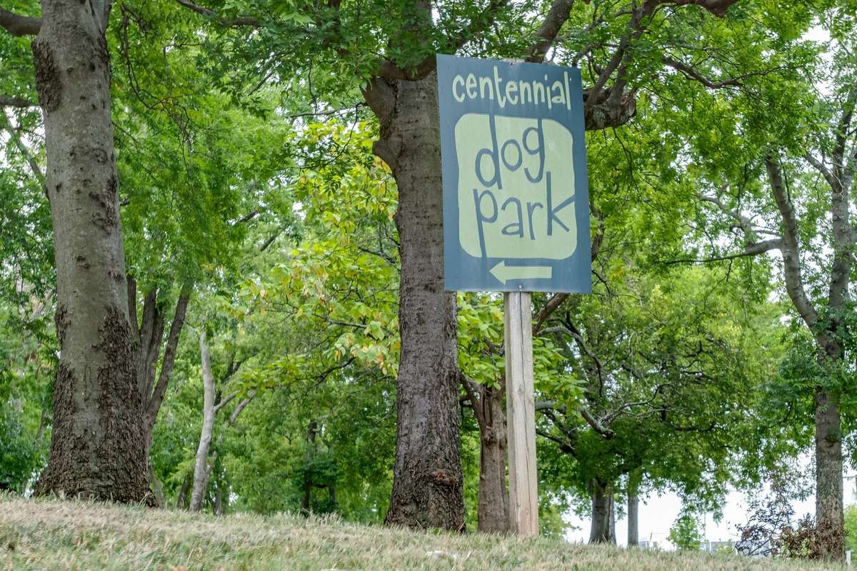 Centennial Park with walking trails, benches and natural grass,  is conveniently located across the street and includes a two separate areas for small and large dogs.