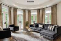 Love this Living Room with 4 working French Doors leading to the front patio with a view of the large green park across the street.