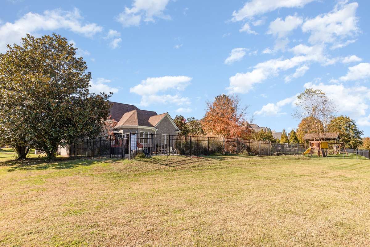 Yard extends beyond fenced-in area and is equal to neighbors fence line
