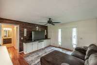 A beautiful wood accent wall and hardwood floors give this room comfort and style.