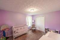 Step on in to the secondary bedroom, which is nearly the same size as the primary suite!