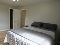 Main suite leading into the living room and into the ensuite