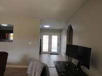 From the front door you have plenty of room. Wide doorway to the kitchen and a wide hallway for the secondary bedrooms and bath,