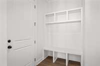 Boot bench to store your coats and shoes by garage entrance