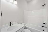 secondary full bath attached to 2nd bedroom