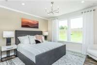 Photo of Contour Model Home's Owner's Bedroom Suite. Actual colors & selections may vary.