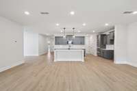 Darlington kitchen and living space. Photos are of similar home, same plan. Colors, interior selections, elevations and upgrades may vary.