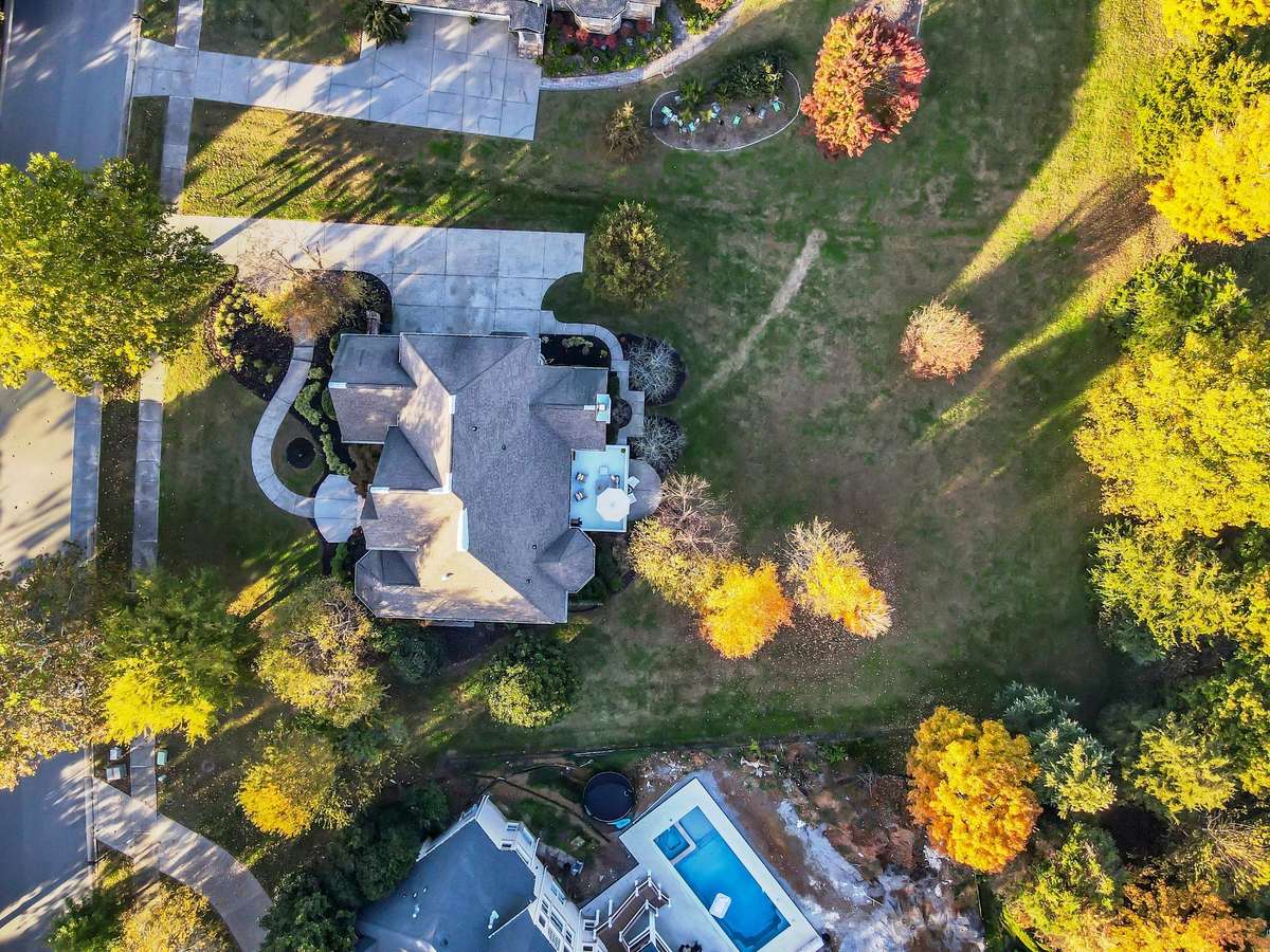 Three-car garage and extended driveway with plenty of guest parking and easy rear entry.
