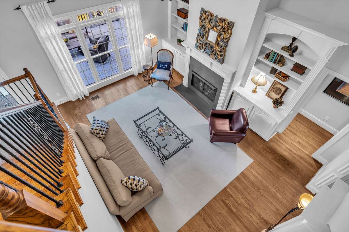 Expansive windows frame serene views and open to the outdoor entertaining deck.