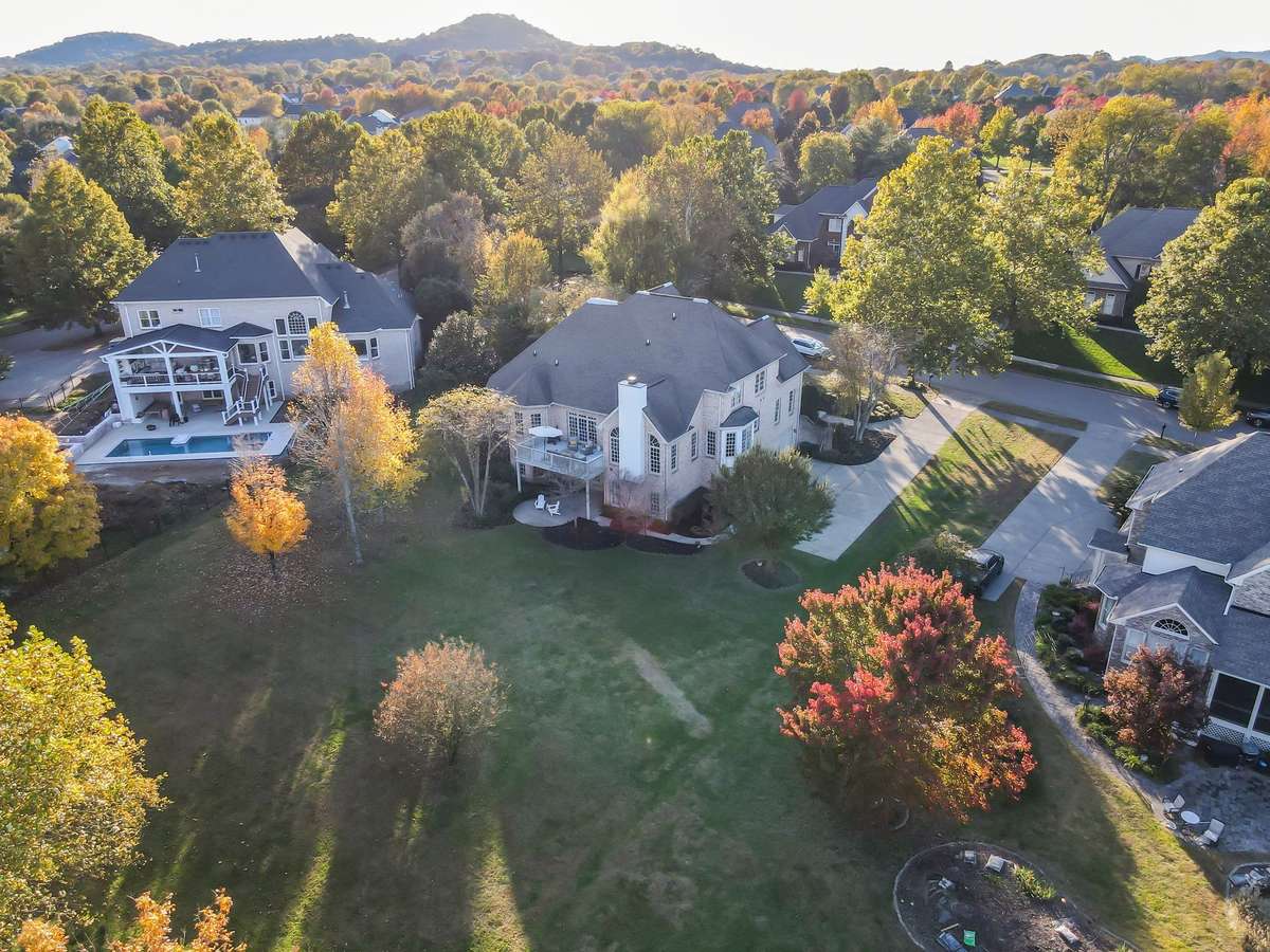Expansive homesite with private tree line and generous open yard, beautifully positioned within the neighborhood.