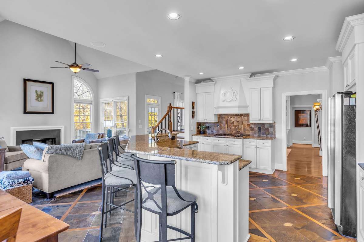 Open-concept layout connects the kitchen and living areas, ideal for modern living and gatherings.
