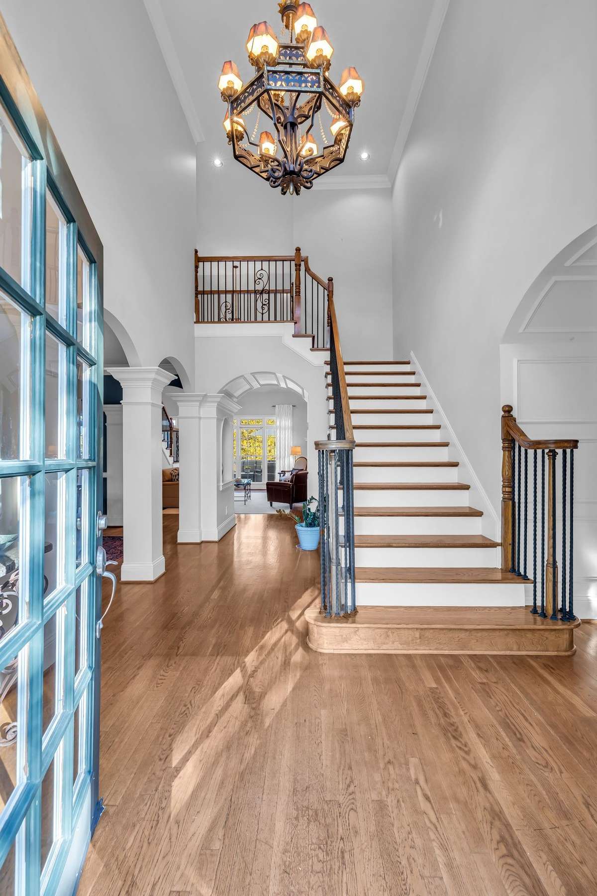 Soaring ceilings and gleaming hardwoods welcome you into an impressive two-story foyer.