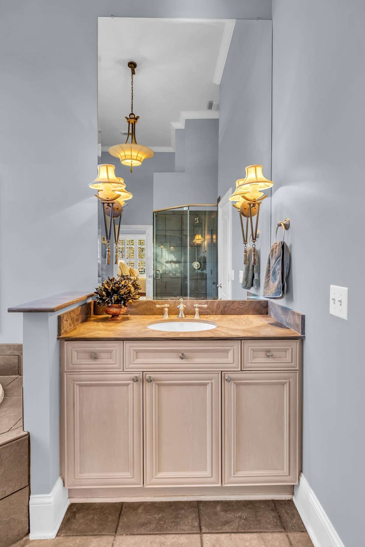 Warm lighting and elegant finishes add sophistication to this thoughtfully designed space.