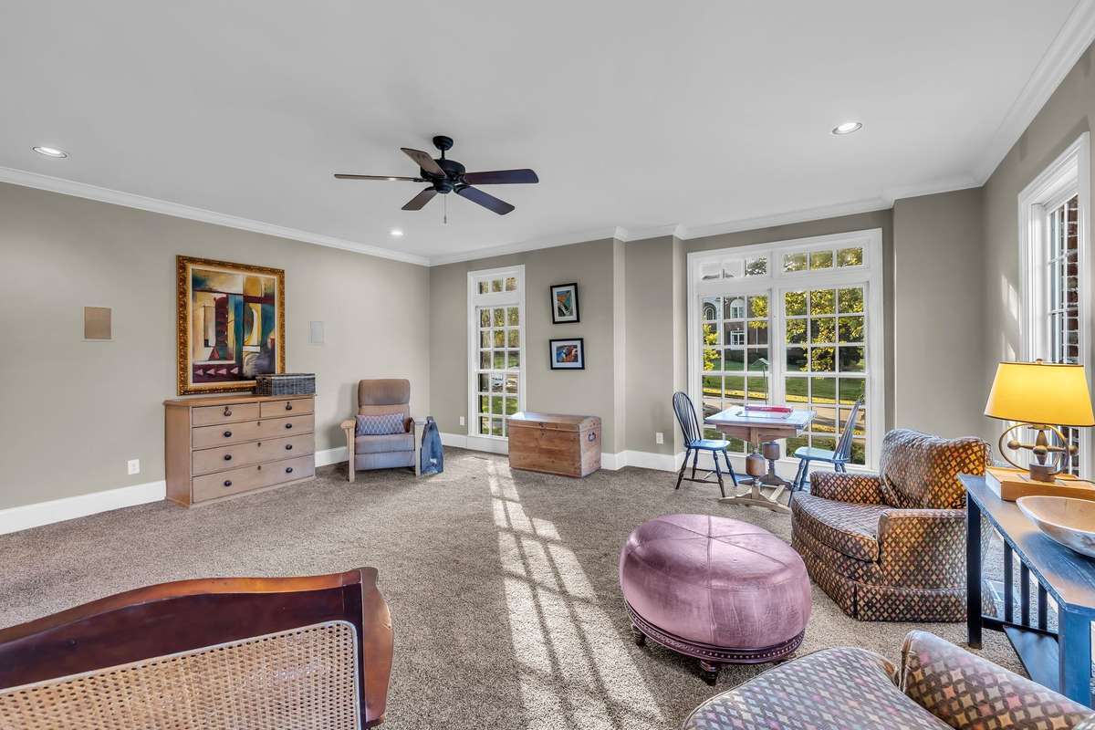 Natural light pours through multiple windows, creating a bright, inviting gathering area.