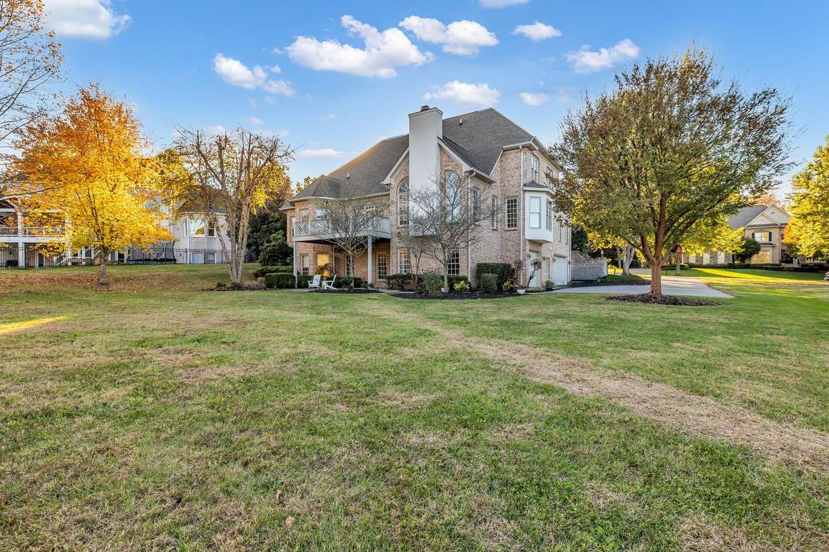 Sweeping lawn provides privacy, space for play, and a serene natural setting.