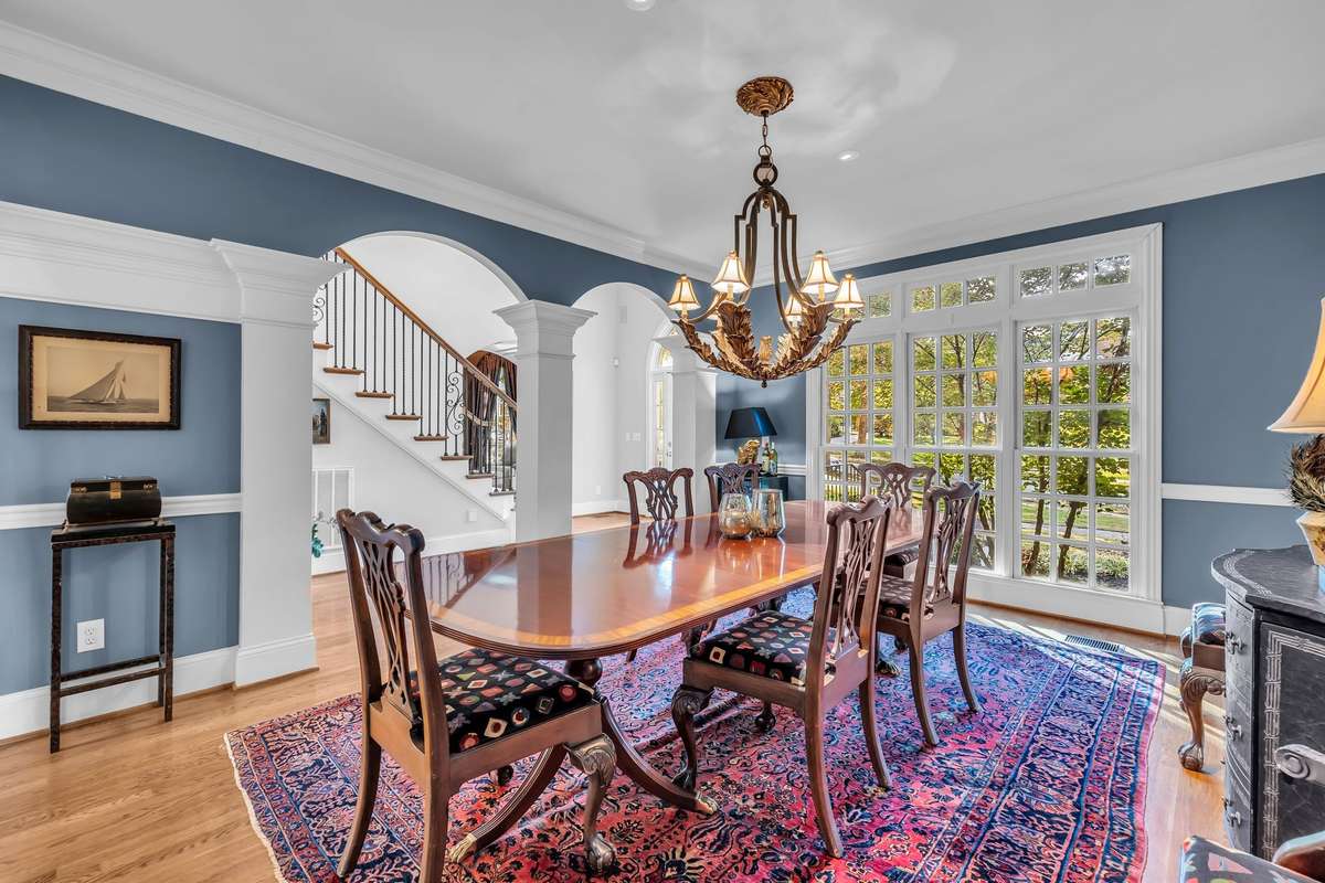 Graceful arches and architectural detail frame the dining area, ideal for entertaining in style.