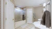 Texas Bath with double closets off the Primary Bedroom with tile floors.