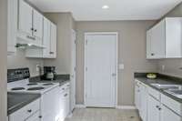 Kitchen view. Door leads to laundry room