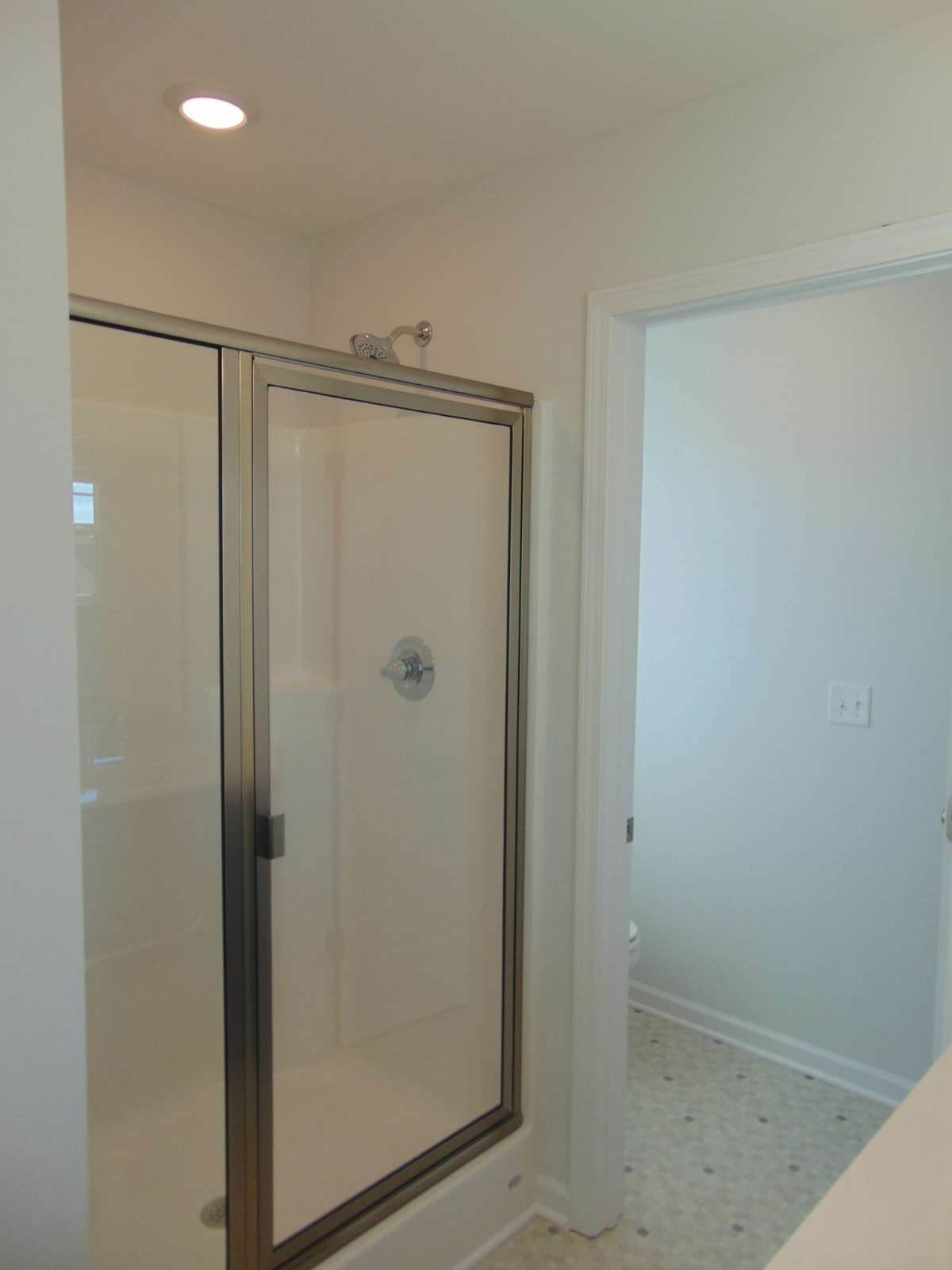 The primary bathroom has a soak in tub and shower, as well as two sinks.