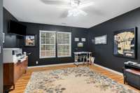 5th bedroom downstairs (currently used as an office) on lower level with wood floors and walk-in closet.