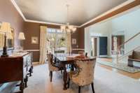 Another view of the formal dining room with foyer and office/formal living room in the background