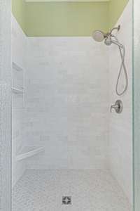 Renovated primary bathroom custom tile shower