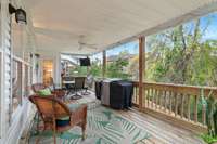 Covered deck off home's main level.  Privacy with view of mature trees