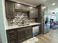 All kitchen appliances stay with the home and if you’d like the coffee bar it can be yours as well