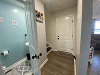 Nice half bath right at the base of the stairs and inside the garage door