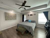 Large (14x16) primary bedroom with tray ceiling