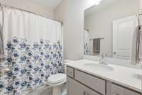 First floor bathroom with shower/tub combo.