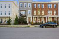 Exterior — End Unit Townhome
Bright, modern 3BR/3.5BA end-unit townhome with extra windows, abundant natural light, and sleek curb appeal in desirable Burkitt Commons.