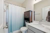 Secondary bedroom bathroom en suite with combo shower/tub.