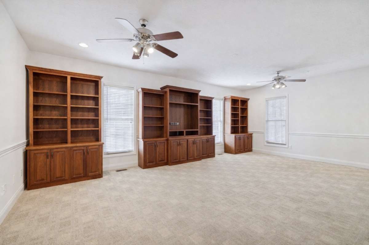 HUGE Rec Room on MAIN LEVEL (bigger than photo suggests!).  There are steps from this room up to large storage area with a dormer window that can be expanded to 4th bedroom/bath if needed.