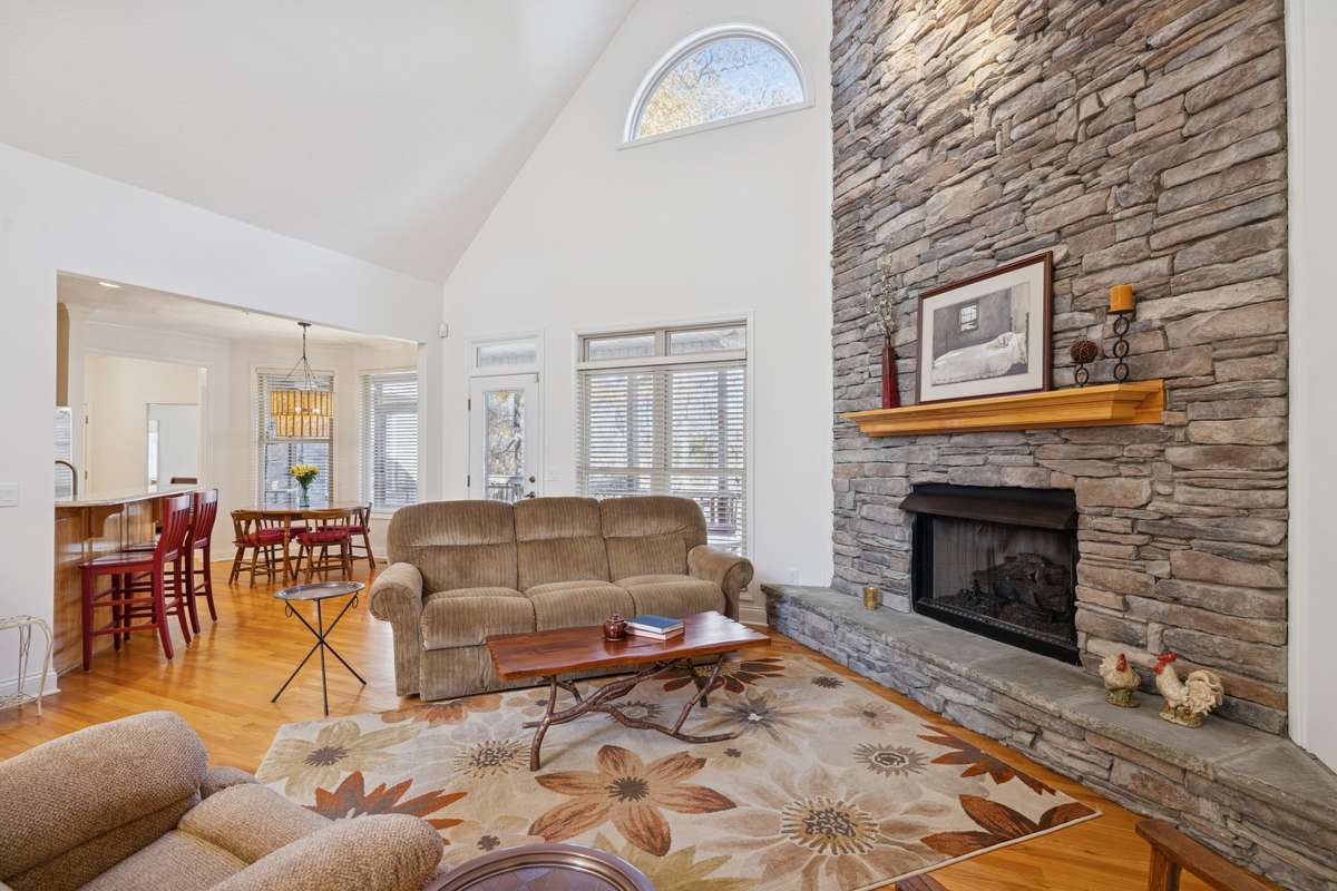 Large Great Room features beautiful stone fireplace with gas logs, and is light and bright! Opens to Kitchen and Breakfast Area.