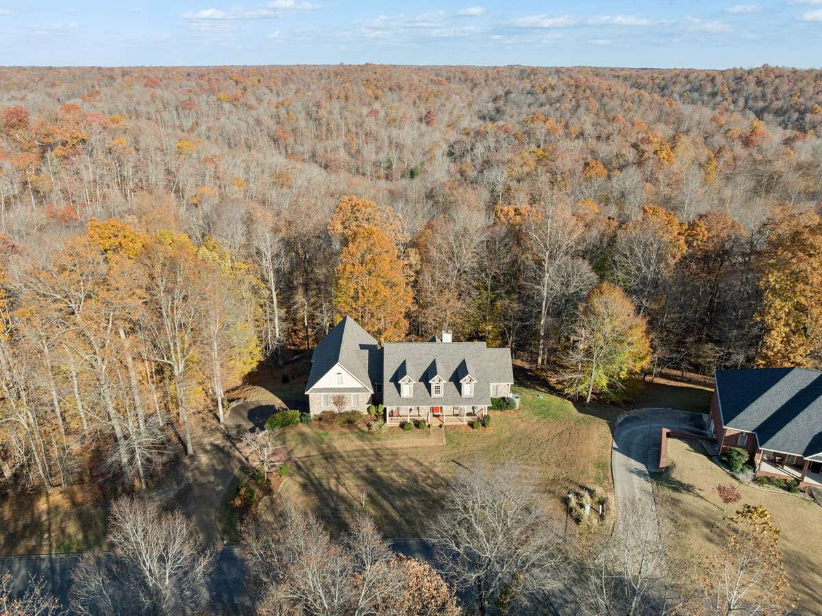 This is your quiet wooded setting, on a cul-de-sac with a handful of neighbors.  The only thing you hear are the sounds of nature and the comforting sound of chapel chimes in the distance from time to time.