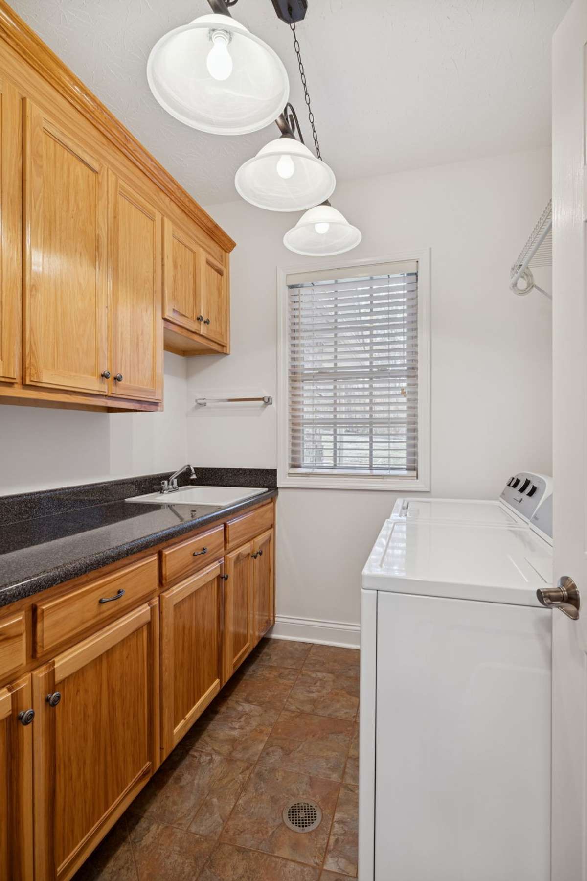 Laundry is located adjacent to Rec Room and near Owner’s Suite, making easy access. Folding laundry is a breeze when you can watch your favorite show in the Rec Room at the same time!