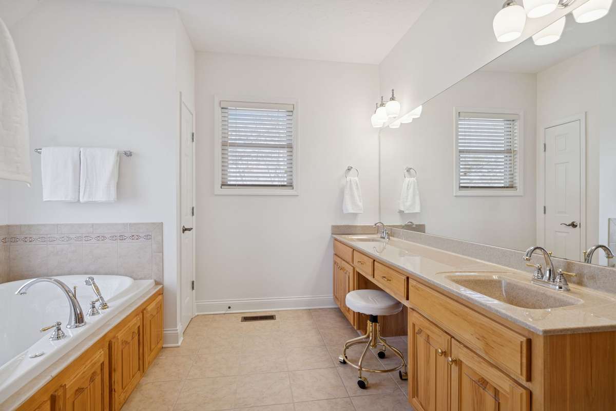 Large mirror, double sinks, and a bathroom where you never really need to close the blinds… total privacy with a great view!