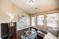 The sunroom at the back of the home offers a flexible space for a library, office, or quiet retreat.