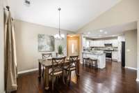 The connection between the kitchen and dining space is seamless. the extended bar allows for additional seating, serving, or prepping.