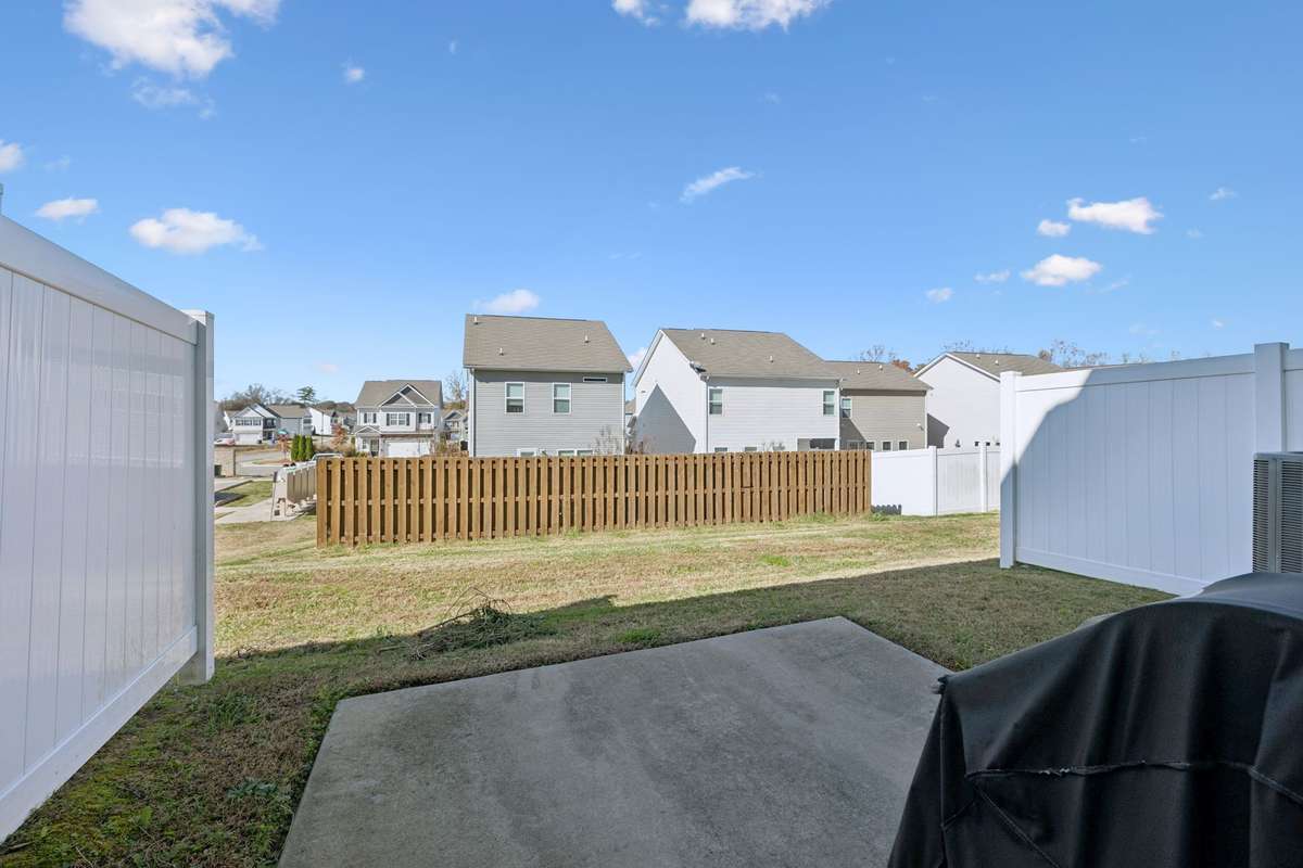 View of your backyard, with two large vinyl Privacy dividers.  2605 Sherman Way Columbia TN 38401