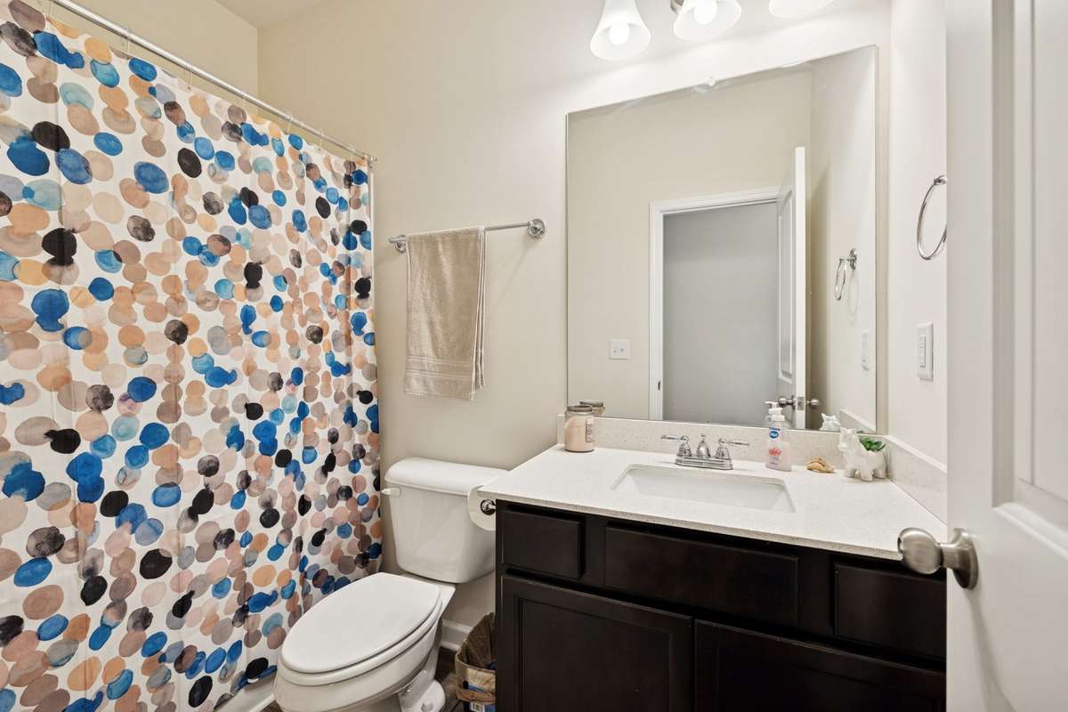 Upstairs full bath with a single vanity sink.  2605 Sherman Way Columbia TN 38401
