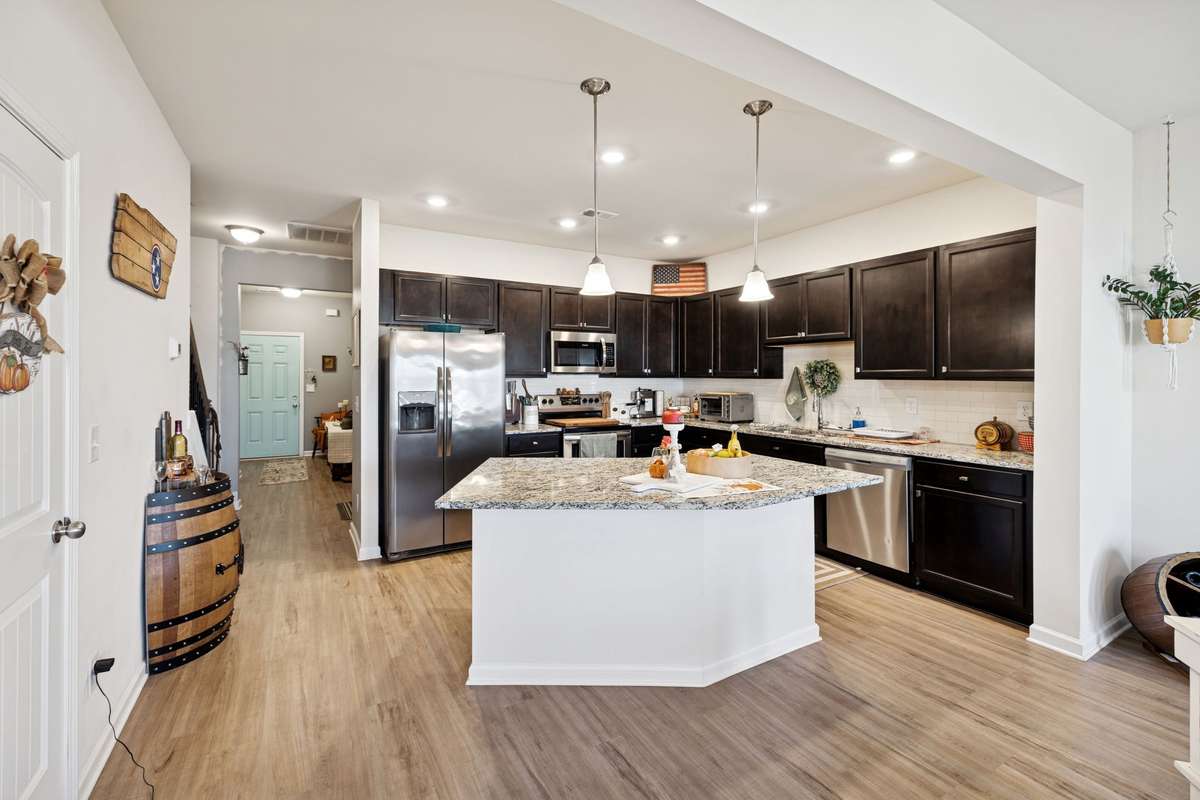 Kitchen provides a large island with a bar and available seating.  2605 Sherman Way Columbia TN 38401