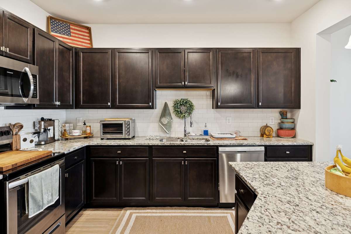Stylish white subway tile backsplash and stainless steel appliances creating the perfect finishing touches.  2605 Sherman Way Columbia TN 38401