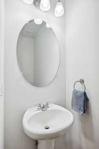 Convenient half bath for guests on the main floor.
