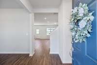 Beautiful laminate wood flooring extends throughout the first floor living areas.