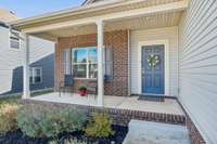 This large covered front porch is the perfect place to sit and enjoy your morning coffee!