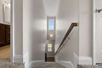 Stairwell leads to additional 3 bedrooms, bonus room and 2 full bathrooms.