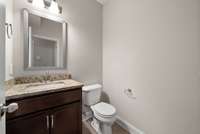 Half bath located on the main floor, but tucked away for privacy.